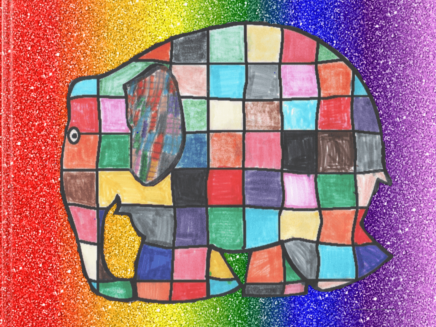 A colorful drawing of Elmer the Elephant, created by a first-grade student. The elephant is composed of a patchwork of squares in various vibrant colors, including red, blue, green, yellow, pink, and black. The background features a gradient of colors, transitioning from red on the left to orange, yellow, green, blue, and purple on the right, with a glittery texture throughout. Elmer's cheerful, multicolored appearance stands out against the sparkling rainbow backdrop.